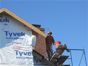 Contractor during home siding project